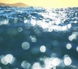 Background image of water in the bright sun.