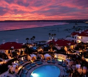 Image of the KSL resort from above with a lovely sunset and ocean in the background.